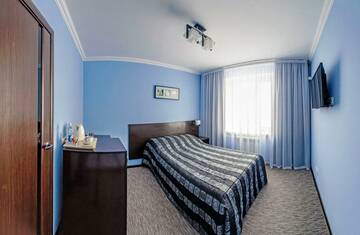 Номер стандарт семейный с 1 двуспальной кроватью в Гостинице Лада